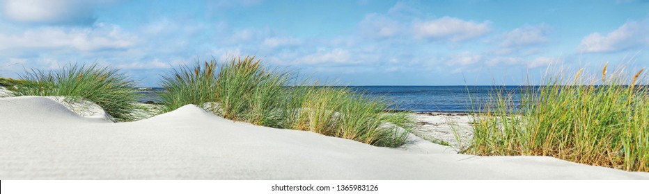 Baltic Sea Beach with Sand Dunes, Ocean View. Sunny Weather with Clouds. Ostsee Panorama.