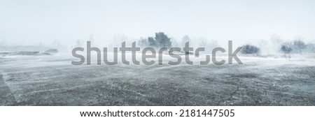 Baltic sea coast after storm and blizzard. Liepaja, Latvia. Epic spring landscape. Cyclone, gale, rough weather, meteorology, climate change, natural phenomenon