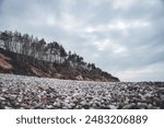 Baltic sea coastal line shoreside wide angle view. Photo taken on a cloudy autumn day in Latvia, Baltic.Scandinavia style.