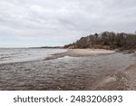 Baltic sea coastal line shoreside wide angle view. Photo taken on a cloudy autumn day in Latvia, Baltic.Scandinavia style.