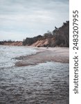 Baltic sea coastal line shoreside wide angle view. Photo taken on a cloudy autumn day in Latvia, Baltic.Scandinavia style.