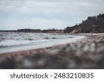 Baltic sea coastal line shoreside wide angle view. Photo taken on a cloudy autumn day in Latvia, Baltic.Scandinavia style.