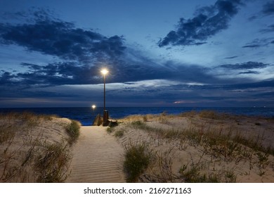 Baltic Sea Shore At Night. Modern Wooden Pathway (boardwalk). Beach, Sand Dunes, Dune Grass. Clear Sky, Midnight Sun. Nature, Vacations, Wanderlust, Local Travel, Ecotourism, Hiking, Healthy Lifestyle