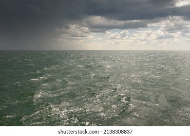 Baltic Sea Under Dramatic Clouds. Thunderstorm. Blue Sky. Panoramic Aerial View From The Coast. Seascape. Cyclone, Gale, Storm, Rough Weather, Meteorology, Climate Change, Natural Phenomenon