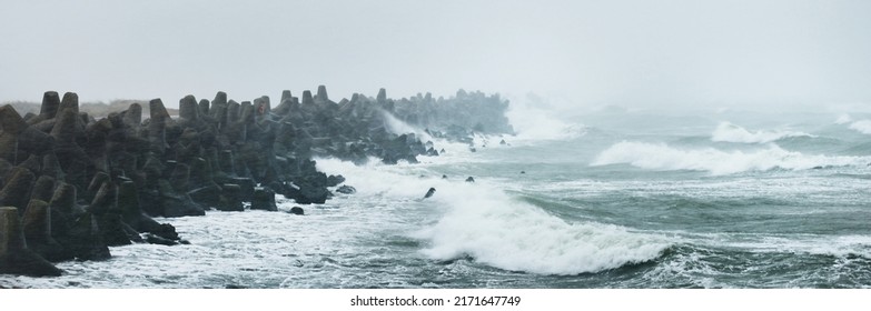 Baltic Sea Under Dramatic Sunset Clouds After Storm. Liepaja, Latvia. Breakwaters Close-up. Epic Spring Landscape. Cyclone, Gale, Rough Weather, Meteorology, Climate Change, Natural Phenomenon