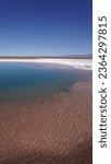 Baltiche hidden lagoon, turquoise salt water in Atacama salt desert Chile