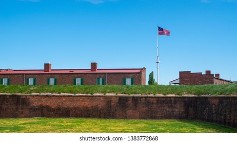 Baltimore, MD—April 24, 2019; Historic Version Of American Flag From War Of 1812 Flies Over Brick Walls Of Fort McHenry, Site That Inspired United States National Anthem, The Star Spangled Banner