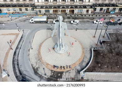 Baltimore Maryland - February 23 2022: Aerial View Of The Male-Female Statue Outside Of Baltimore's Penn Station With People Sitting Below