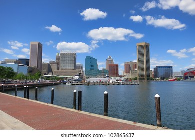 Baltimore Maryland inner Harbor scenic area and downtown skyline cityscape with excursion boats in port