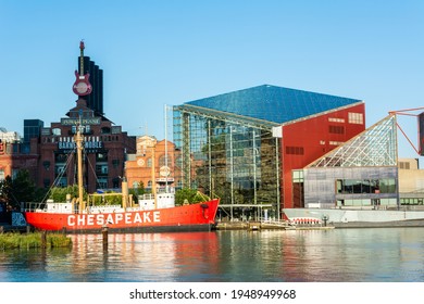 Baltimore, Maryland, United States of America – September 6, 2016. The Inner Harbour of Baltimore, MD, with USCG Lightship Chesapeake historic ship, National Aquarium building and Power Plant building