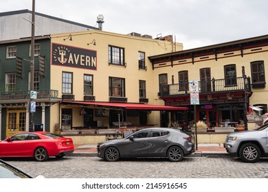 Baltimore, Maryland US - April 9, 2022: Fells Point Tavern along cobble stone Thames street in historic waterfront restaurant and bar district