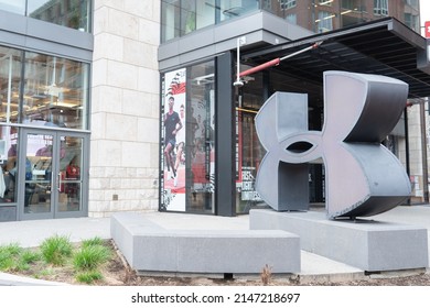 Baltimore, Maryland US - April 9, 2022: Large 3d Sculpture Of Under Armour Logo Outside Of Flagshipbrick And Mortar Retail Store Location In Harbor East Downtown Neighborhood