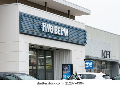 Baltimore, Maryland, US - February 24, 2022: Store Front Exterior Of Five Below Retail Store In Downtown Strip Mall With Busy Parking Lot Full Of Urban Resident Shoppers