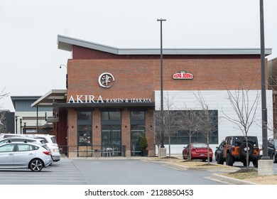 Baltimore, Maryland, US - February 24, 2022: Exterior Of Akira Ramen Noodle Izakaya And Delivery Pizza Papa Johns Locations In A Strip Mall Shopping Center At Canton Crossing