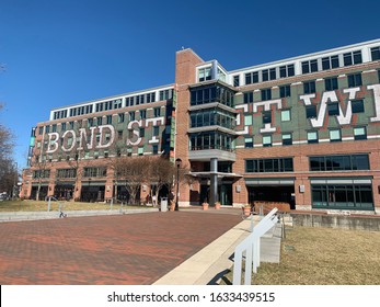 Baltimore, Maryland / US - January 29, 2020: exterior facade of Bond Street Wharf Building on Thames street in historic Fell's Point mixed use commercial real estate with restaurant and office space
