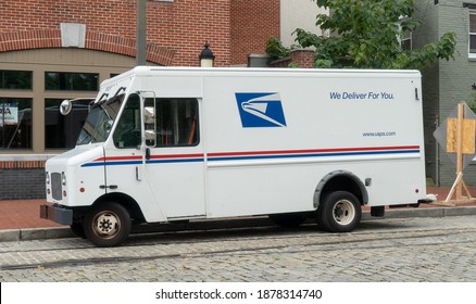 Baltimore, Maryland US - July 31 2020: Parked Unattended USPS United States Postal Service Truck Delivery Vehicle On Urban Downtown City Street Making Letter Carrier Runs To Private Residences