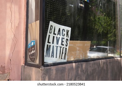 Baltimore, Maryland US - June 25, 2022: A Black Lives Matter Protest Sign On White Poster Board On Display In A Store Front Window Downtown In The Mount Vernon Arts District