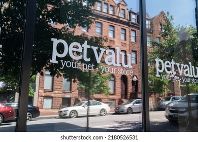 Baltimore, Maryland US - June 25, 2022: A Store Front Window Of A Now Closed Down Retail PetValu Your Pet Store Location With Reflective Tint Showing Urban Buildings Across The Street