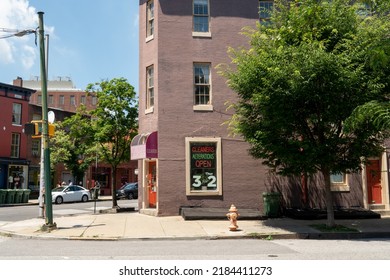 Baltimore, Maryland US - June 25, 2022: Dry Cleaner Business On Ground Floor Street Level Of Multi Story Brick Building