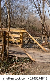 Baltimore, Maryland US - March 19, 2021: Metal And Wood Support Structure Of A Man Made Footbridge Walking Path Crossing Over Stoney Run Adjacent To The Johns Hopkins University Homewood Campus