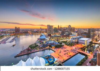 Baltimore, Maryland, USA city skyline over the Inner Harbor at twilight. 
