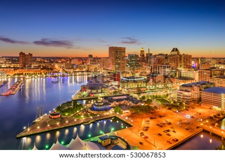 Baltimore, Maryland, USA inner harbor and downtown skyline at twilight.