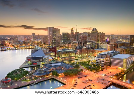 Baltimore, Maryland, USA inner harbor and downtown skyline at dusk.