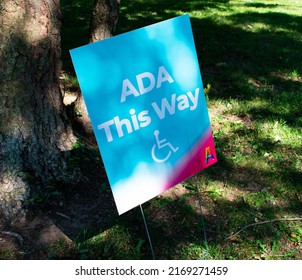 Baltimore, Maryland, USA - June 18 2022: A Sign Leading The Way For ADA Accessibility At The AFRAM Festival In Druid Hill Park. 