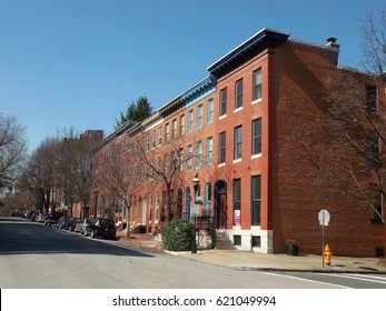 Baltimore, MD:  Midtown Neighborhood Of Bolton Hill; Corner Of Park Ave. And Lanvale St.  Three-story Rowhouses.  Wide, Tree-lined Street.