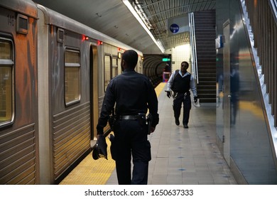 Baltimore, MD, USA - April 4 2019: A Police Officer Checks Out The Subway At The Station.