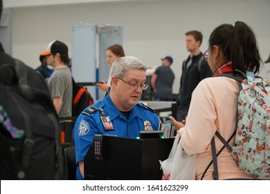 Baltimore, MD, USA - April 8 2019: TSA (Transportation Security Administration) Worker Checks Out Passport At The BWI Airport.