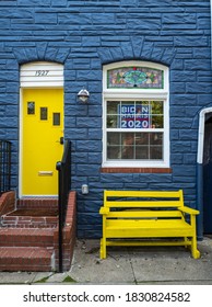 Baltimore, MD, USA -- Oct 4, 2020. Vertical Photo Of A Brightly Painted Row House  In Baltimore.