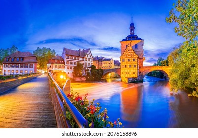 Bamberg, Bavaria. Old Town Hall, Obere Brucke And Regnitz River Dusk Illuminated. Germany City Break Travel Place.