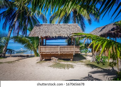 Bamboo bungalow on the beach among palm trees. Coron island, Philippines