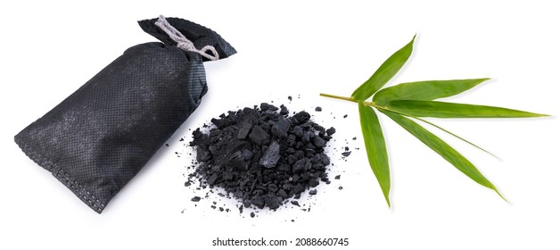 Bamboo Charcoal With Bamboo Leaves Isolated On White Background, Natural Bamboo Charcoal Used To Reduce Bad Odour On White Background.