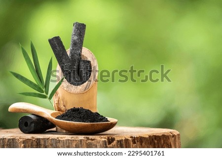 Bamboo charcoal and powder on nature background.