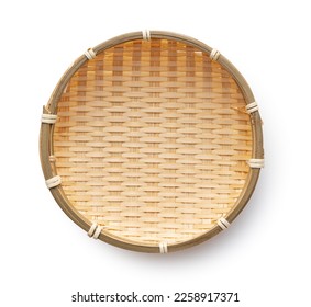 Bamboo colander placed against a white background. Viewed from above.