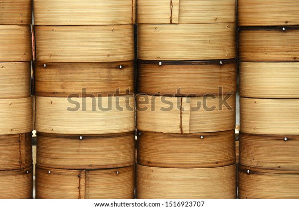 Bamboo food container textured backgrounds of Dim\
sum Chinese cuisine,\
Yumcha