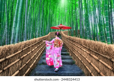 Bamboo Forest. Asian woman wearing japanese traditional kimono at Bamboo Forest in Kyoto, Japan. - Powered by Shutterstock