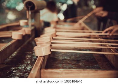 Bamboo Ladles Used For Ritual Purification At Japanese Shinto Shrine