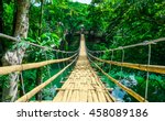 Bamboo pedestrian hanging bridge over river in tropical forest, Bohol, Philippines, Southeast Asia