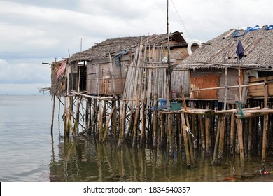 Bamboo Poles Support The Stilt Bajau Shanty Houses Built By Indigenous People In The Philippines. Medium Close Up