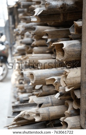 Bamboo raw materials being dried out to allow for locals to use in the building of structures for local homes in the town of Tachileik, in the Republic of Myanmar (Burma).