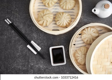 Bamboo steamers with baozi dumplings on table