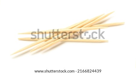 Bamboo toothpicks on white background