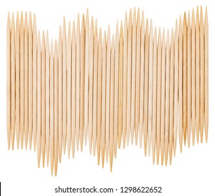 Bamboo toothpicks are placed in parallel - backgrounds, textures. Bamboo toothpicks isolated on white background.
