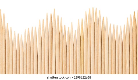 Bamboo toothpicks are placed in parallel - backgrounds, textures. Bamboo toothpicks isolated on white background.
