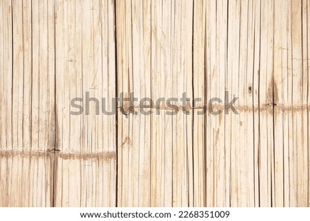 Bamboo wood texture wall fence with vertical seamless patterns light brown background