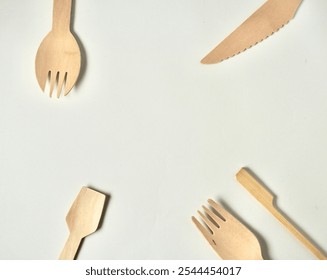 Bamboo wooden kitchenware eating utensil spork, spoon, fork, and knife objects isolated on horizontal ratio copy spaced white background. - Powered by Shutterstock