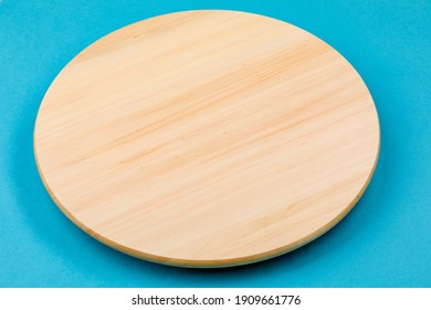 Bamboo or wooden rotating tray, on a blue background - Shutterstock ID 1909661776
